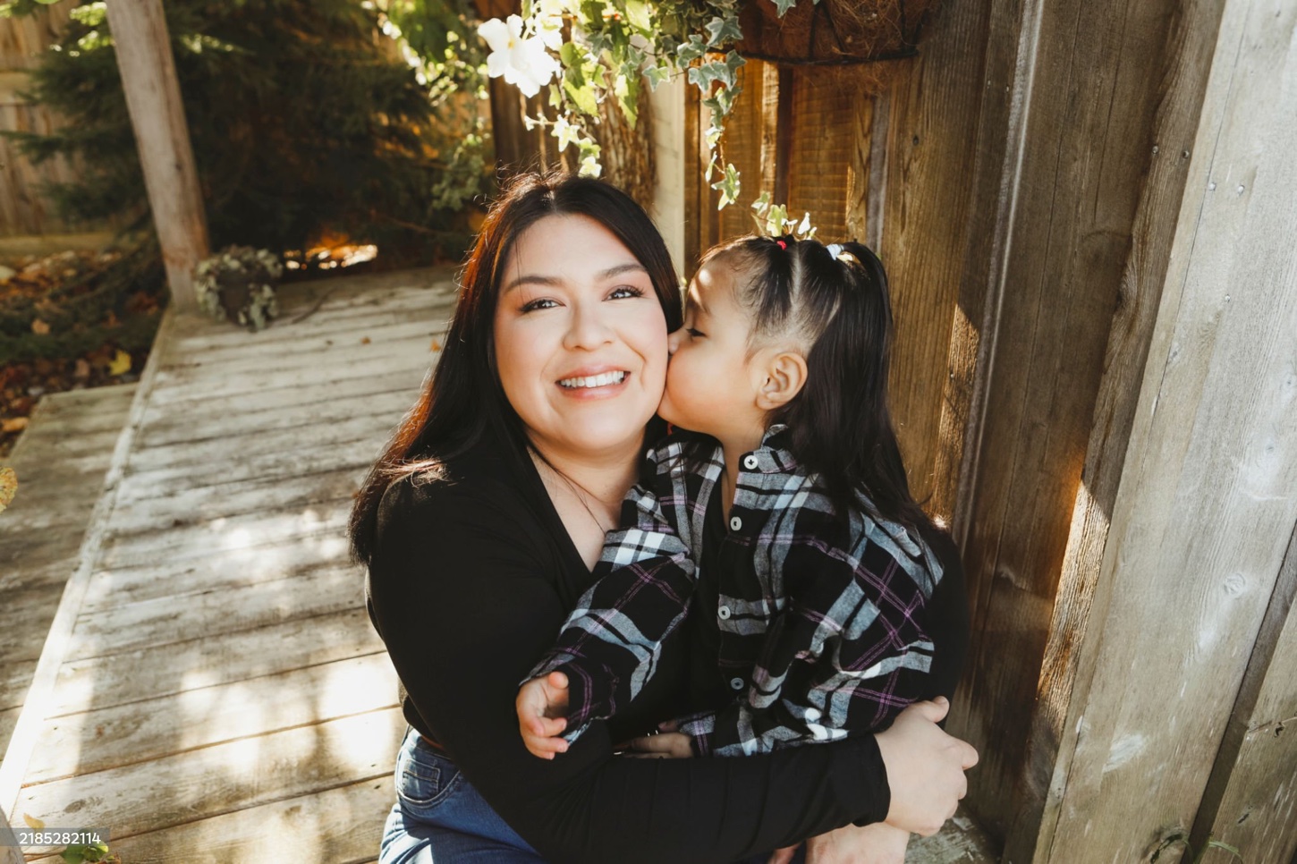 Woman smiling and holding her daughter